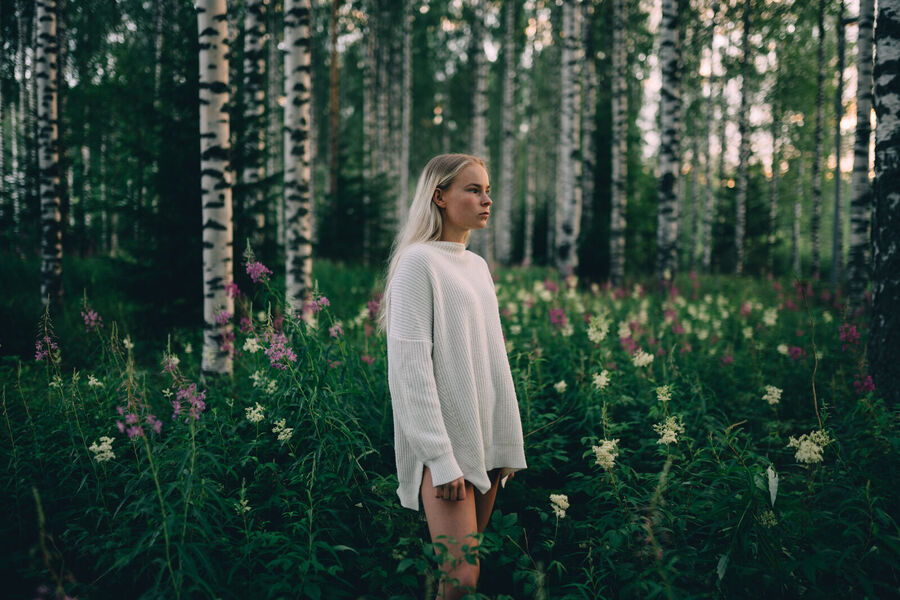 Portrait in a birch grove on a summer evening